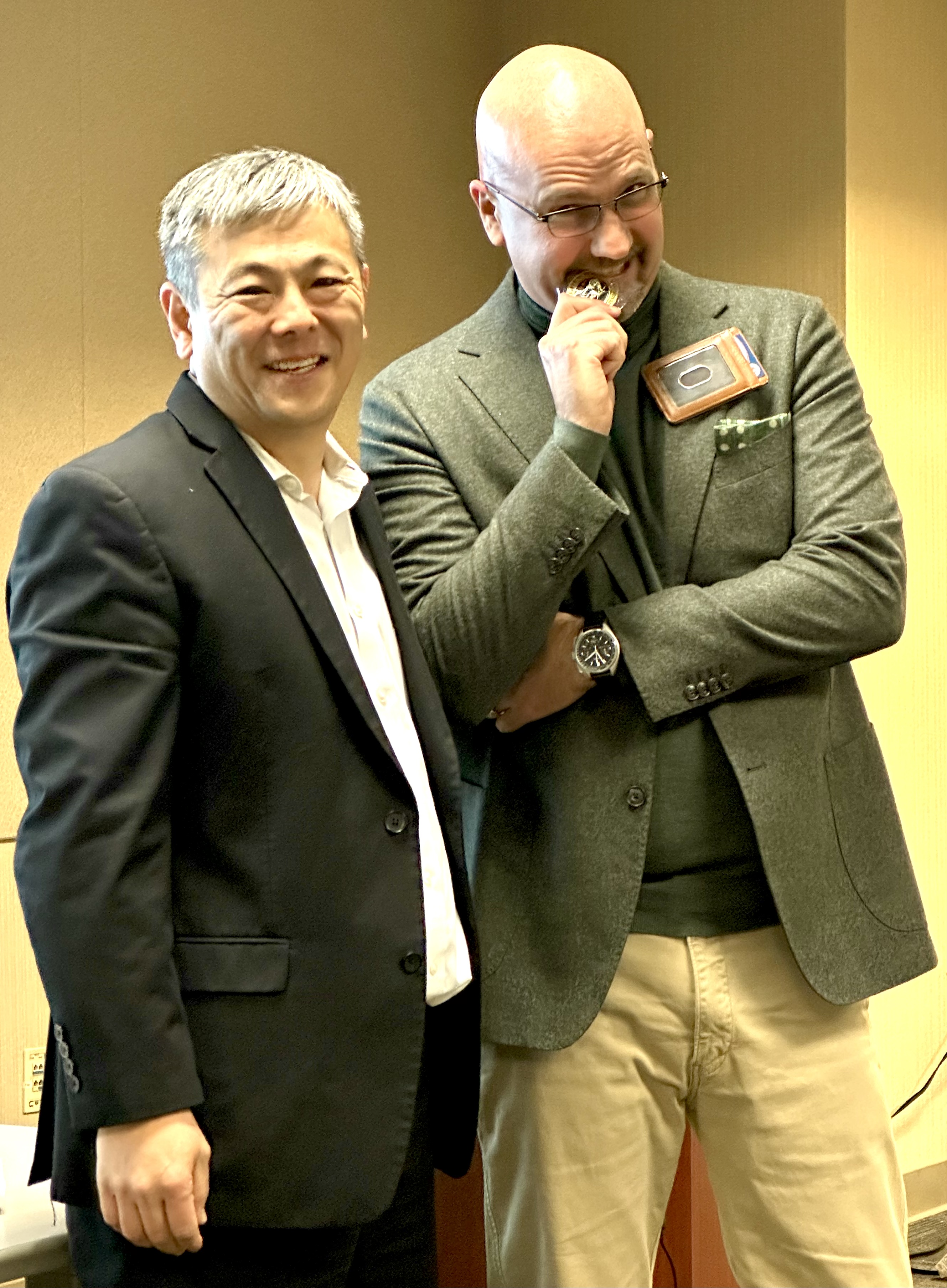 Hoeppel receiving a Customer Service Challenge Coin